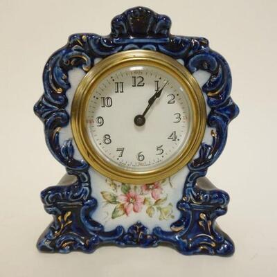1027	SETH THOMAS CHINA CLOCK *LILY* APPROXIMATELY 3 1/4 IN X 6 1/2 IN X 7 3/4 IN HIGH
