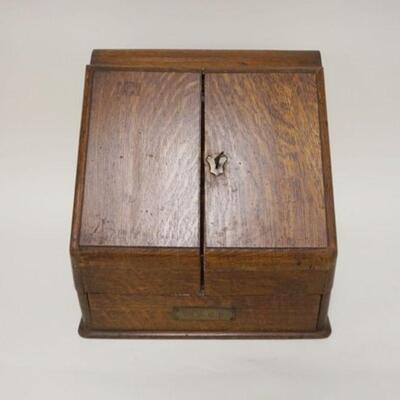 1005	ANTIQUE OAK TABLE TOP STATIONARY BOX, SLANT FRONT W/COMPARTMENTS & CALENDER, DRAWER AT BASE, APPROXIMATELY 13 1/2 IN X 10 IN X 13 IN...