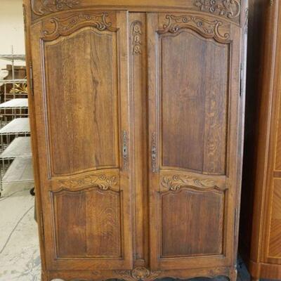 1115	COUNTRY FRENCH CARVED OAK WARDROBE, DOUBLE DOOR W/ADJUSTABLE INTERIOR SHELVING, APPROXIMATELY 56 IN X 22 IN X 80 IN HIGH
