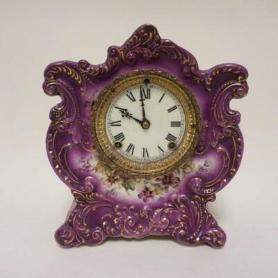 1083	ANSONIA ROYAL BONN LAVENDAR CHINA CLOCK *WINER* APPROXIMATELY 5 1/2 IN X 9 IN X 11 1/4 IN HIGH
