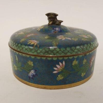 1094	CLOISONNE ROUND COVERED BOX W/FOO DOG MOUNTED AT TOP, APPROXIMATELY 8 IN X 3 1/2 IN, SMALL CHIP ON LID TOP
