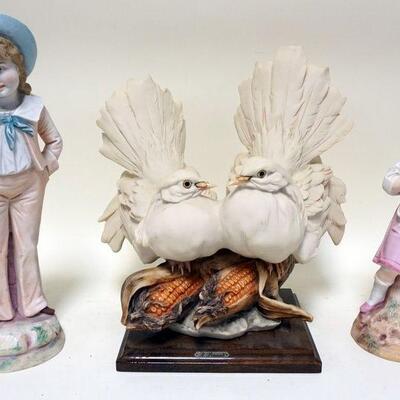 1246	LOT R. PENNNATI CAPODIMONTE PORCELAIN DOVE PERCHED ON TOP OF CORN COBS AND 2 BISQUE FIGURES OF BOY AND GIRL HOLDING A CAT
