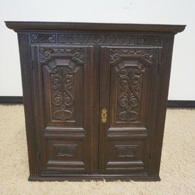 1222	ANTIQUE CONTINENTAL 2 DOOR CARVED CABINET W/DATE OF 1771 ON TOP, 2 CARVED PANELED DOORS, CASE HAVING REEDED COLUMNS & INTERIOR SHELF...