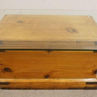 1138	PRIMITIVE PINE CHEST UTILIZED AS A GLASS TOP COFFEE TABLE, APPROXIMATELY 36 IN X 24 IN X 16 3/4 IN HIGH
