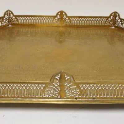 1180	LARGE ORNATE BRASS FOOTED SERVING TRAY, APPROXIMATELY 18 IN X 24 IN X 4 IN HIGH
