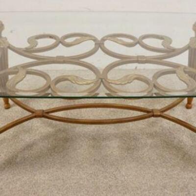 1107	ORNATE GLASS TOP COFFEE TABLE W/METAL VINE LIKE SCROLL & TAPERED FLUTTED LEGS, APPROXIMATELY 51 IN X 30 IN X 19 IN HIGH
