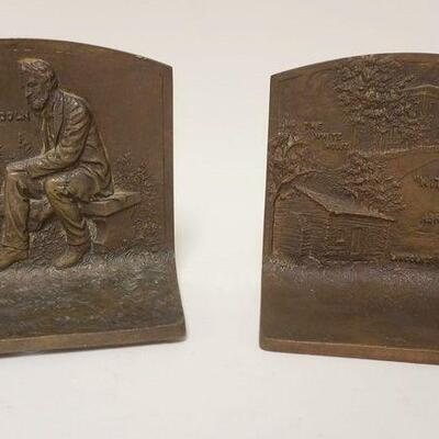1166	BRONZE ABRAHAM LINCOLN BOOKENDS DATED C 1916 W/WHITEHOUSE & LINCOLN BIRTH PLACE, APPROXIMATELY 3 IN X 5 1/2 IN X 5 IN HIGH

