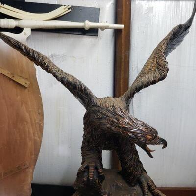 The eagles are carved by an artist.  Each is made from one single piece of a tree.
