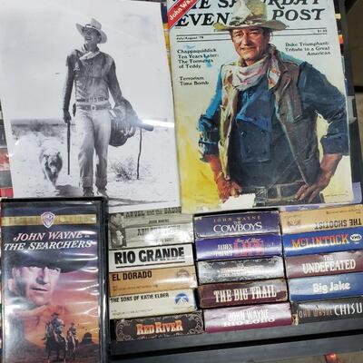 16 John Wayne movies! An old black and white photo of him and The Saturday evening post with him on the cover.  What a great collection!