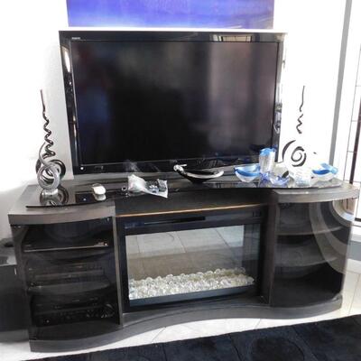 Entertainment unit with built in color changing fireplace