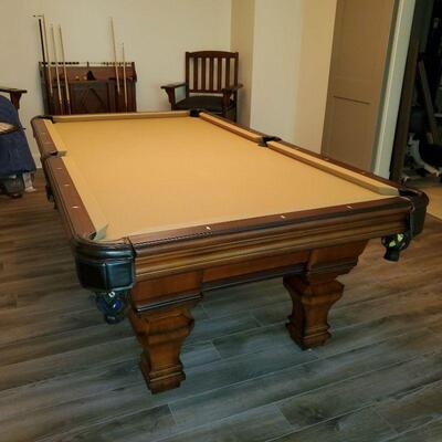 8 foot pool table, ping pong top and all accessories, not including King chairs. Top of the line.
