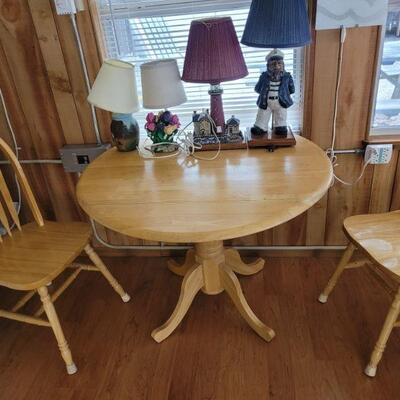 oak table and two chairs, sold as a set