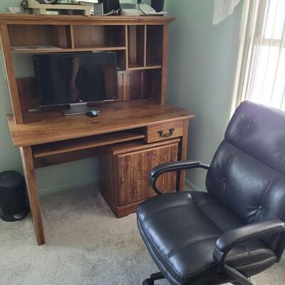 small desk with hutch top and an office chair