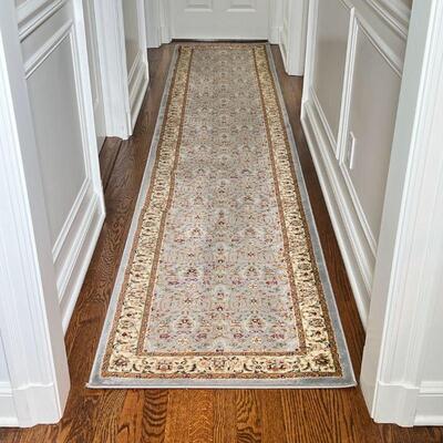 CONTEMPORARY RUNNER | Hallway carpet having a light blue ground with overall field of tan floral sprays; 12 ft. x 2 ft. 4 in.