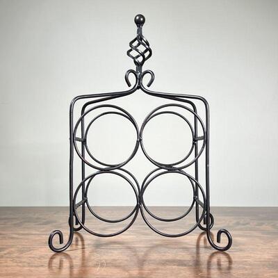 WIRE METAL WINE RACK | Tabletop wine rack, holds 4 bottles, with twisted finial and scroll feet; h. 15-1/2 in.