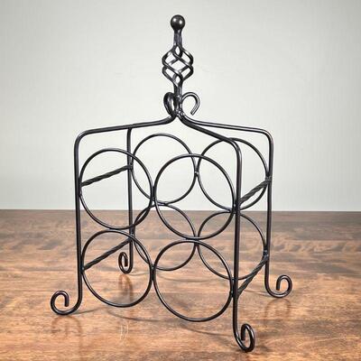 WIRE METAL WINE RACK | Tabletop wine rack, holds 4 bottles, with twisted finial and scroll feet; h. 15-1/2 in.