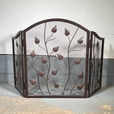 FIREPLACE SCREEN | Black fireplace screen in three panels, decorated with leafy vines; h. 31 x 48 in.
