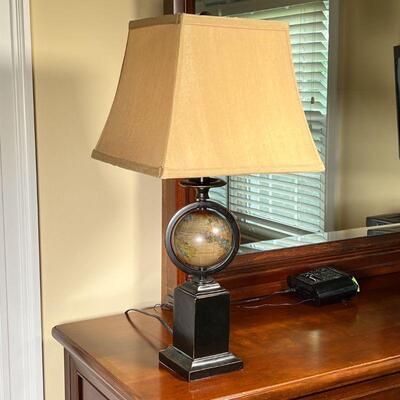 GLOBE TABLE LAMP | Black patinated metal base with a mounted spinning globe, with a square lampshade; overall h. 25 in.