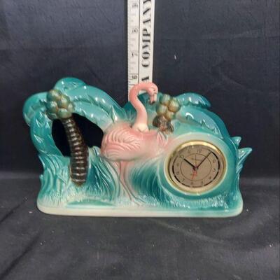 Flamingo figurine with a clock
