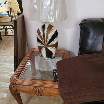 end table, lamp and a big margarita glass 