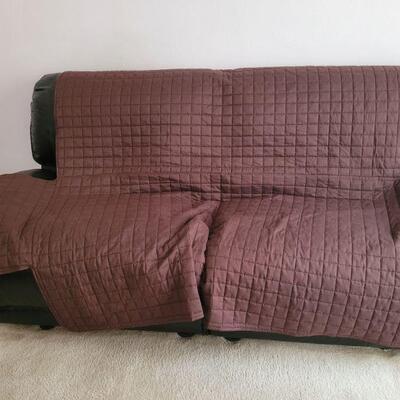 matching sofa with a cover on it