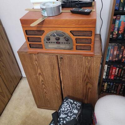 another cabinet and a replica radio, it has a turntable, cd player, tuner and a cassette player