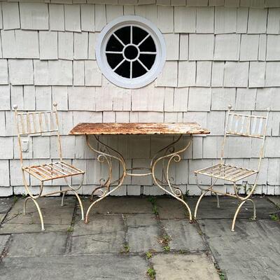 (3pc) ANTIQUE OUTDOOR FURNITURE | Antique patio furniture suite, white painted iron table with a scrollwork base and two chairs with...