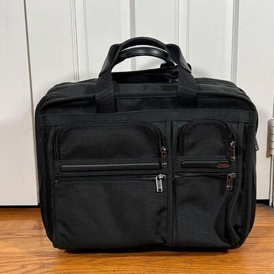  TUMI ROLLING BRIEFCASE | With many storage compartments, appearing in excellent condition; h. 14 x 17 x 8 in.