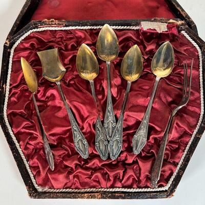 SET SILVER DEMITASSE SPOONS | Boxed set of silver demitasse spoons with gold wash bowls and indistinct hallmark; plus a single sterling...