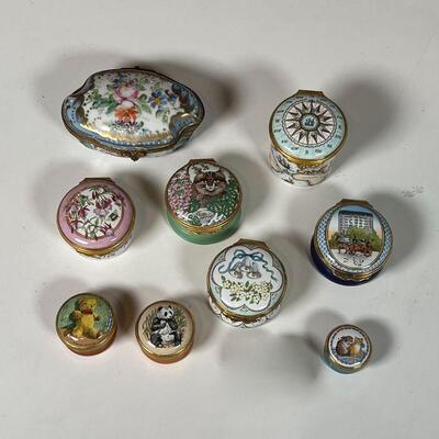 (9pc) PORCELAIN BOXES | Including a hand-painted Sevres box with gilt highlights and marked on the bottom, plus many Halcyon Days Enamels...