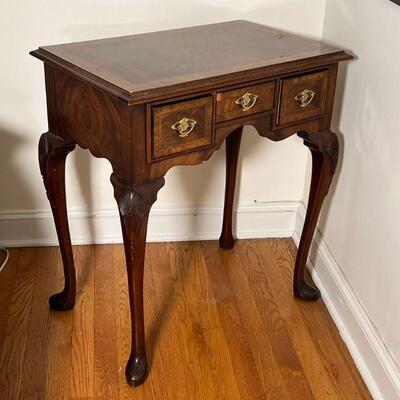 ANTIQUE STYLE SIDE TABLE | Three drawer stand with a contrasting wood top over three drawers with brass pulls on carved cabriole legs; h....