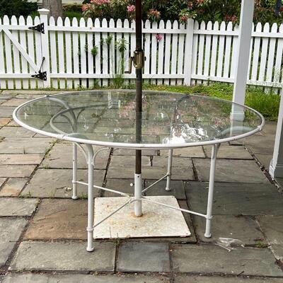 PATIO DINING TABLE | Round white framed glass top outdoor dining table with a Basta Sole umbrella on a white square stand; table h. 29 x...