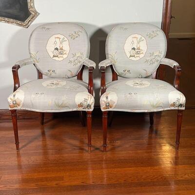 PAIR FANCY ARMCHAIRS | French style carved wood arm chairs / accent chairs with cushioned chinoiserie upholstery, on fluted tapering...