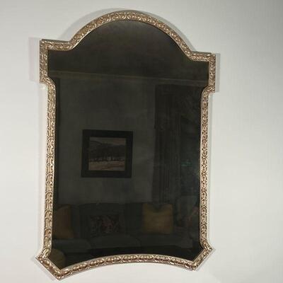 ANTIQUED WALL MIRROR | Large wall mirror, having a gold mottled mirror surface in a gilt / silvered carved frame