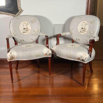 PAIR FANCY ARMCHAIRS | French style carved wood arm chairs / accent chairs with cushioned chinoiserie upholstery, on fluted tapering...