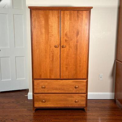 OAK WARDROBE CABINET | Made in USA, two cabinet doors over two drawers; h. 60 x w. 34 x d. 20 in.