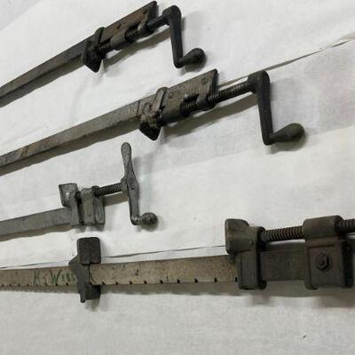 103. Four Large Metal Furniture Clamps