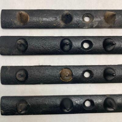 411. Three Vintage Cast Iron Metal Hanging Racks