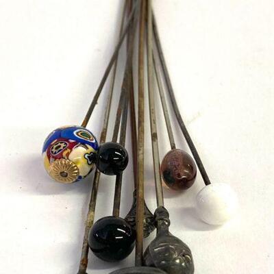 17. Eight Assorted Antique Metal Hat Pins