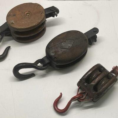 90. Three Wooden Pulleys