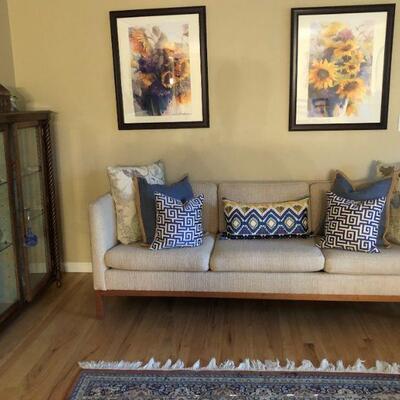 7ft MCM Style Sofa - Upolstered in Wool. Decorative Throw Pillows. Framed Art.