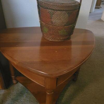 triangular end table and a basket