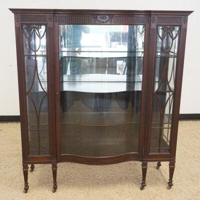 1023	MAHOGANY CHINA CLOSET W/SERPENTINE FRONT & CARVED BOWS, FLUTED COLUMNS, PARTIAL MIRRORED BACK, APPROXIMATELY 54 IN X 18 1/2 IN X 61...