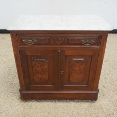 1034	WALNUT VICTORIAN MARBLE TOP WASHSTAND, ONE DRAWER, 2 DOORS, MISSING BACK SPLASH, APPROXIMATELY 31 IN X 17 IN X 32 IN HIGH
