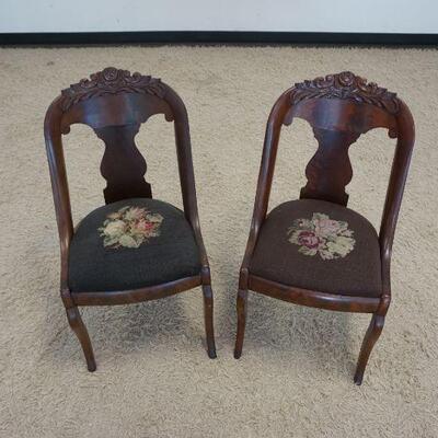 1050	PAIR OF EMPIRE SIDE CHAIRS WNEEDLEPOINT SLIP SEATS & FLORAL CARVED CREST
