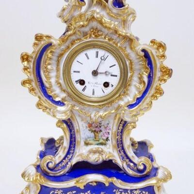 1242	JACOB PETIT PORCELAIN MANTLE CLOCK ON RECTANGULAR BASE, CLOCK DIAL HAS LOSSES, APPROXIMATELY 7 IN X 9 IN X 14 IN OVERALL
