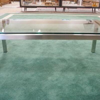 1206	MODERN GLASS TOP COFFEE TABLE W/POLISHED STEEL BASE, APPROXIMATELY 47 IN X 26 IN X 17 IN HIGH
