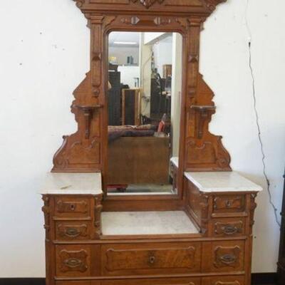 1030	VICTORIAN WALNUT MARBLE TOP CHEST, DROP CENTER W/BURLED PANELED DRAWER FRONTS APPROXIMATELY 52 IN X 20 IN X 90 IN HIGH
