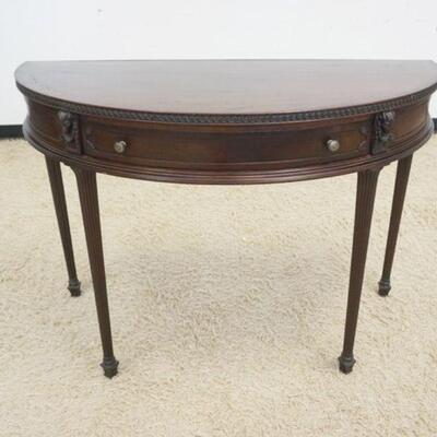 1025	MAHOGANY 1 DRAWER DEMILUNE TABLE W/REEDED COLUMN LEGS & CARVED RAM HEADS, APPROXIMATELY 48 IN X 21 IN X 34 IN HIGH
