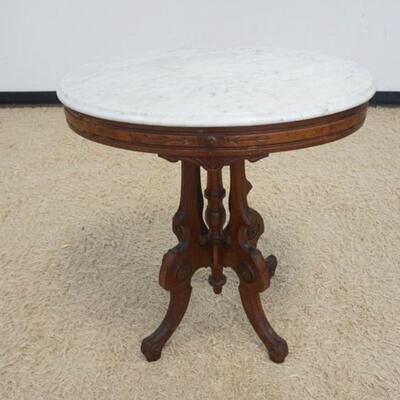 1033	OVAL WALNUT MARBLE TOP VICTORIAN LAMP TABLE, APPROXIMATELY 28 IN X 22 IN X 30 IN HIGH
